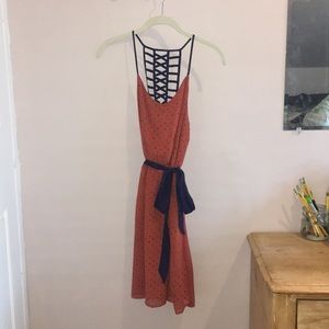 Strappy- backed polka dot dress